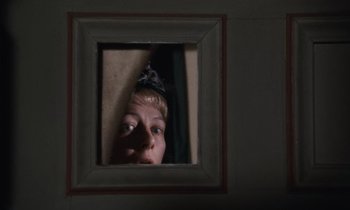 Movie still from “The Bostonians” (1984), directed by James Ivory – A person is looking through a picture frame; Close Up shot, Overhead angle