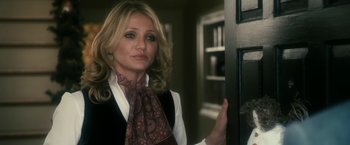 Movie still from “The Box” (2009), directed by Richard Kelly – A woman standing in front of an open door; Close Up shot, Over the shoulder angle