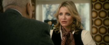 Movie still from “The Box” (2009), directed by Richard Kelly – A person wearing a suit and tie; Close Up shot, Over the shoulder angle