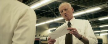 Movie still from “The Box” (2009), directed by Richard Kelly – An older man wearing a white shirt and a black neck tie; Close Up shot, Low angle
