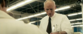 Movie still from “The Box” (2009), directed by Richard Kelly – An older man wearing a white shirt and black tie; Close Up shot, Low angle