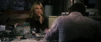 Movie still from “The Box” (2009), directed by Richard Kelly – A woman sitting in front of a man at a table; Medium shot, Over the shoulder angle