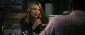 Movie still from “The Box” (2009), directed by Richard Kelly – A person sitting at a table; Close Up shot, Over the shoulder angle