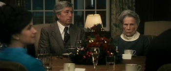 Movie still from “The Box” (2009), directed by Richard Kelly – A man sitting at a dinner table with wine glasses; Medium shot, Over the shoulder angle