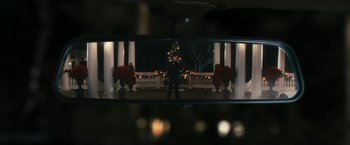 Movie still from “The Box” (2009), directed by Richard Kelly – A man standing in front of a christmas tree; Wide shot, Over the shoulder angle