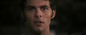 Movie still from “The Box” (2009), directed by Richard Kelly – A man's face in a dark room; Close Up shot, Over the shoulder angle