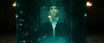 Movie still from “The Box” (2009), directed by Richard Kelly – A man in a suit and tie looking into a mirror; Close Up shot, Overhead angle