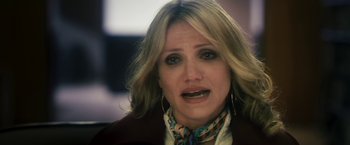 Movie still from “The Box” (2009), directed by Richard Kelly – A person wearing a jacket; Close Up shot, Over the shoulder angle