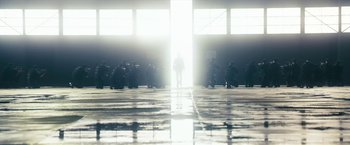 Movie still from “The Box” (2009), directed by Richard Kelly – A group of people standing in front of a window; Extreme Wide shot, Low angle