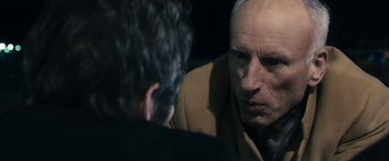 Movie still from “The Box” (2009), directed by Richard Kelly – A man in a brown jacket talking to another man in a brown jacket; Close Up shot, Over the shoulder angle