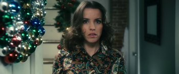 Movie still from “The Box” (2009), directed by Richard Kelly – A person wearing a shirt; Close Up shot, High angle