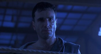 Movie still from “The Boxer” (1997), directed by Jim Sheridan – A person wearing a robe; Close Up shot, Low angle