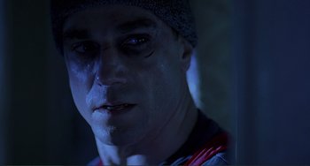 Movie still from “The Boxer” (1997), directed by Jim Sheridan – A person wearing a hat; Close Up shot, Low angle