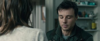 Movie still from “The Boy” (2016), directed by William Brent Bell – A man and a woman looking at one another; Close Up shot, Over the shoulder angle