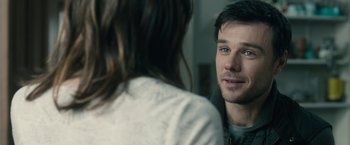 Movie still from “The Boy” (2016), directed by William Brent Bell – A man and a woman looking at one another in a mirror; Close Up shot, Over the shoulder angle