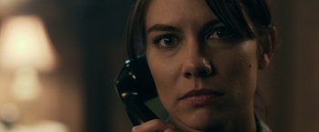 Movie still from “The Boy” (2016), directed by William Brent Bell – A person talking on a phone; Close Up shot, Over the shoulder angle