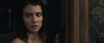 Movie still from “The Boy” (2016), directed by William Brent Bell – A person with wet hair looking at the camera; Close Up shot, Over the shoulder angle