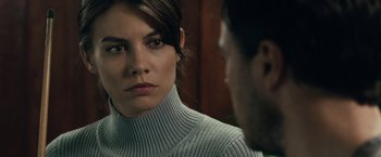 Movie still from “The Boy” (2016), directed by William Brent Bell – A person wearing a sweater looking at another person; Close Up shot, Over the shoulder angle