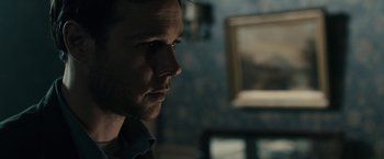 Movie still from “The Boy” (2016), directed by William Brent Bell – A person looking at something; Close Up shot, Over the shoulder angle