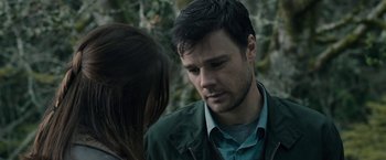 Movie still from “The Boy” (2016), directed by William Brent Bell – A man and a woman looking at one another; Close Up shot, Over the shoulder angle