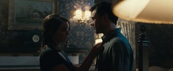 Movie still from “The Boy” (2016), directed by William Brent Bell – A man and a woman looking at each other; Close Up shot, Over the shoulder angle