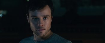 Movie still from “The Boy” (2016), directed by William Brent Bell – A man's face in the dark; Close Up shot, Over the shoulder angle