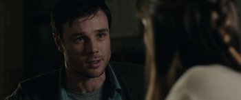 Movie still from “The Boy” (2016), directed by William Brent Bell – A person looking at another person; Close Up shot, Over the shoulder angle