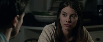 Movie still from “The Boy” (2016), directed by William Brent Bell – A woman sitting in front of a bowl of food; Close Up shot, Over the shoulder angle