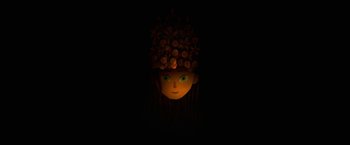Movie still from “The Breadwinner” (2017), directed by Nora Twomey – A child's face with a flower hat on; Medium shot, Overhead angle