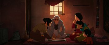 Movie still from “The Breadwinner” (2017), directed by Nora Twomey – A group of people sitting on the floor in front of a window; Wide shot, High angle
