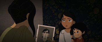 Movie still from “The Breadwinner” (2017), directed by Nora Twomey – A woman is looking at a picture of a man; Close Up shot, Over the shoulder angle