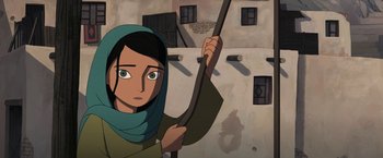Movie still from “The Breadwinner” (2017), directed by Nora Twomey – An animated woman holding a wooden stick in her hand; Medium shot, Over the shoulder angle