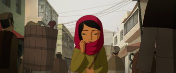 Movie still from “The Breadwinner” (2017), directed by Nora Twomey – An animated woman with a red head covering is standing in the middle of a crowded street; Close Up shot, Over the shoulder angle