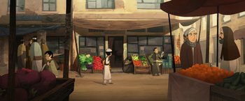 Movie still from “The Breadwinner” (2017), directed by Nora Twomey – Two people standing in front of a store with vegetables on display; Extreme Wide shot, Over the shoulder angle