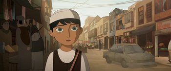 Movie still from “The Breadwinner” (2017), directed by Nora Twomey – An animated person standing on a city street; Close Up shot, Over the shoulder angle