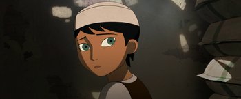 Movie still from “The Breadwinner” (2017), directed by Nora Twomey – A cartoon of a boy with a white hat on his head; Close Up shot, Over the shoulder angle