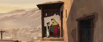 Movie still from “The Breadwinner” (2017), directed by Nora Twomey – An illustration of a woman and a boy in front of a building; Wide shot, Low angle
