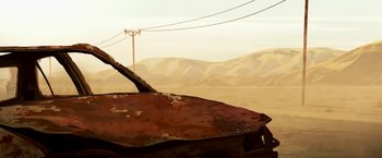 Movie still from “The Breadwinner” (2017), directed by Nora Twomey – An old rusted boat sitting in the middle of the desert; Extreme Wide shot, Low angle