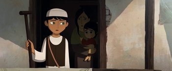 Movie still from “The Breadwinner” (2017), directed by Nora Twomey – An animated picture of a woman holding a child; Medium shot, Over the shoulder angle