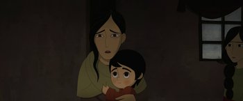 Movie still from “The Breadwinner” (2017), directed by Nora Twomey – An animated woman holding a young boy in her arms; Close Up shot, High angle