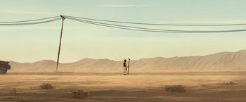 Movie still from “The Breadwinner” (2017), directed by Nora Twomey – An image of a man standing on top of a ladder in the middle of the desert; Extreme Wide shot, Low angle