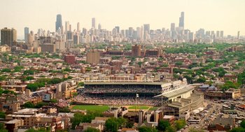 Movie still from “The Break-Up” (2006), directed by Peyton Reed – An aerial view of a baseball stadium and a city skyline; Extreme Wide shot, High angle