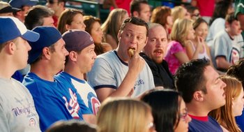 Movie still from “The Break-Up” (2006), directed by Peyton Reed – A group of men sitting in a stadium watching a baseball game; Medium shot, Overhead angle
