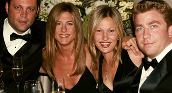 Movie still from “The Break-Up” (2006), directed by Peyton Reed – Two beautiful women posing for a picture in front of flowers; Close Up shot, Overhead angle