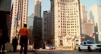Movie still from “The Break-Up” (2006), directed by Peyton Reed – A man walking down a street in a city; Extreme Wide shot, Low angle