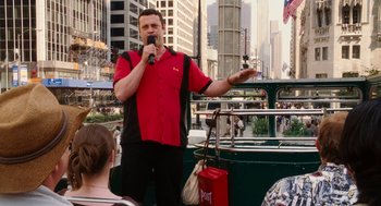 Movie still from “The Break-Up” (2006), directed by Peyton Reed – A man in a red and black shirt is on a boat; Medium shot, Over the shoulder angle