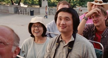Movie still from “The Break-Up” (2006), directed by Peyton Reed – A man and a woman smiling for the camera; Close Up shot, High angle