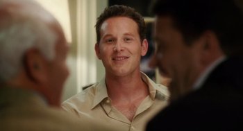 Movie still from “The Break-Up” (2006), directed by Peyton Reed – A man that is talking to two other men; Close Up shot, Over the shoulder angle