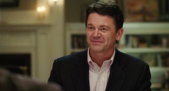 Movie still from “The Break-Up” (2006), directed by Peyton Reed – A person wearing a suit and tie; Close Up shot, Over the shoulder angle