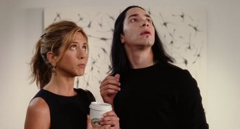 Movie still from “The Break-Up” (2006), directed by Peyton Reed – A man and a woman holding a cup of coffee; Medium shot, Low angle